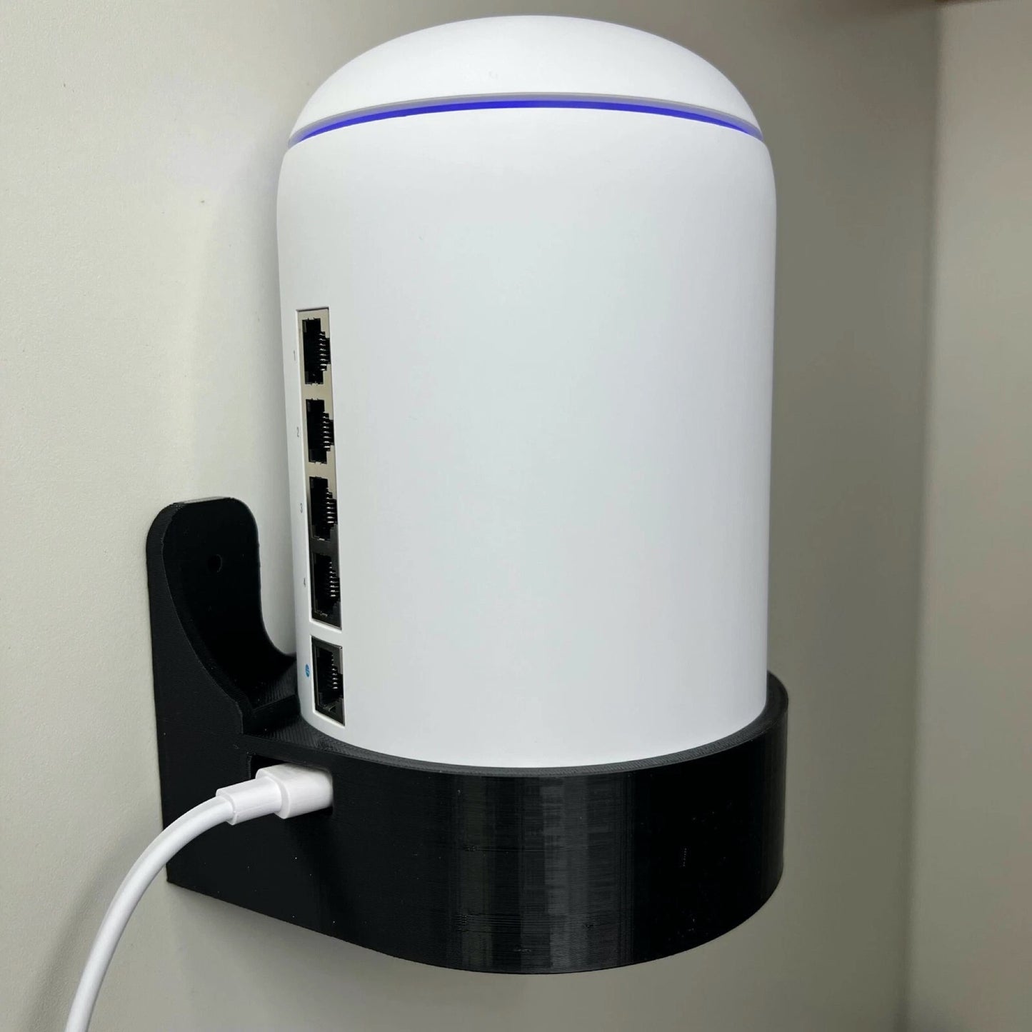 Front cradle view of Rack Forged wall mount for UniFi Dream Machine and Dream Router