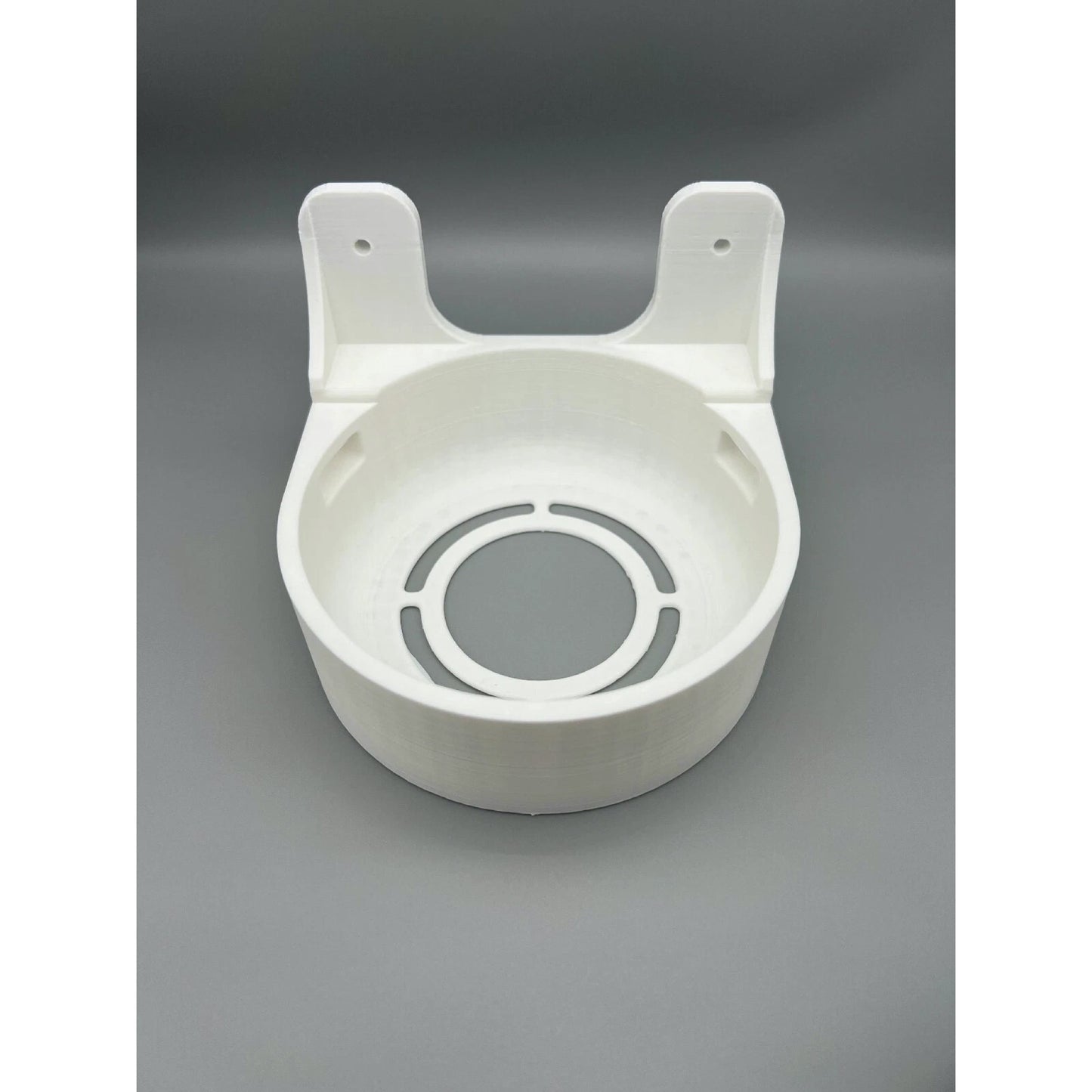 Angled view of Rack Forged wall mount for UniFi Dream Machine and Dream Router