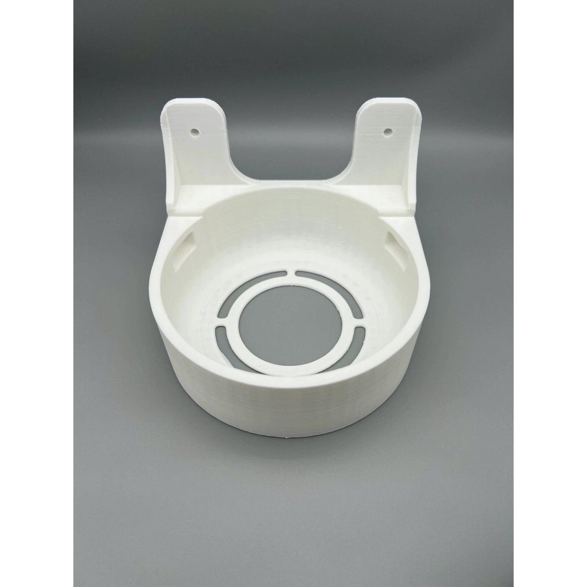Angled view of Rack Forged wall mount for UniFi Dream Machine and Dream Router