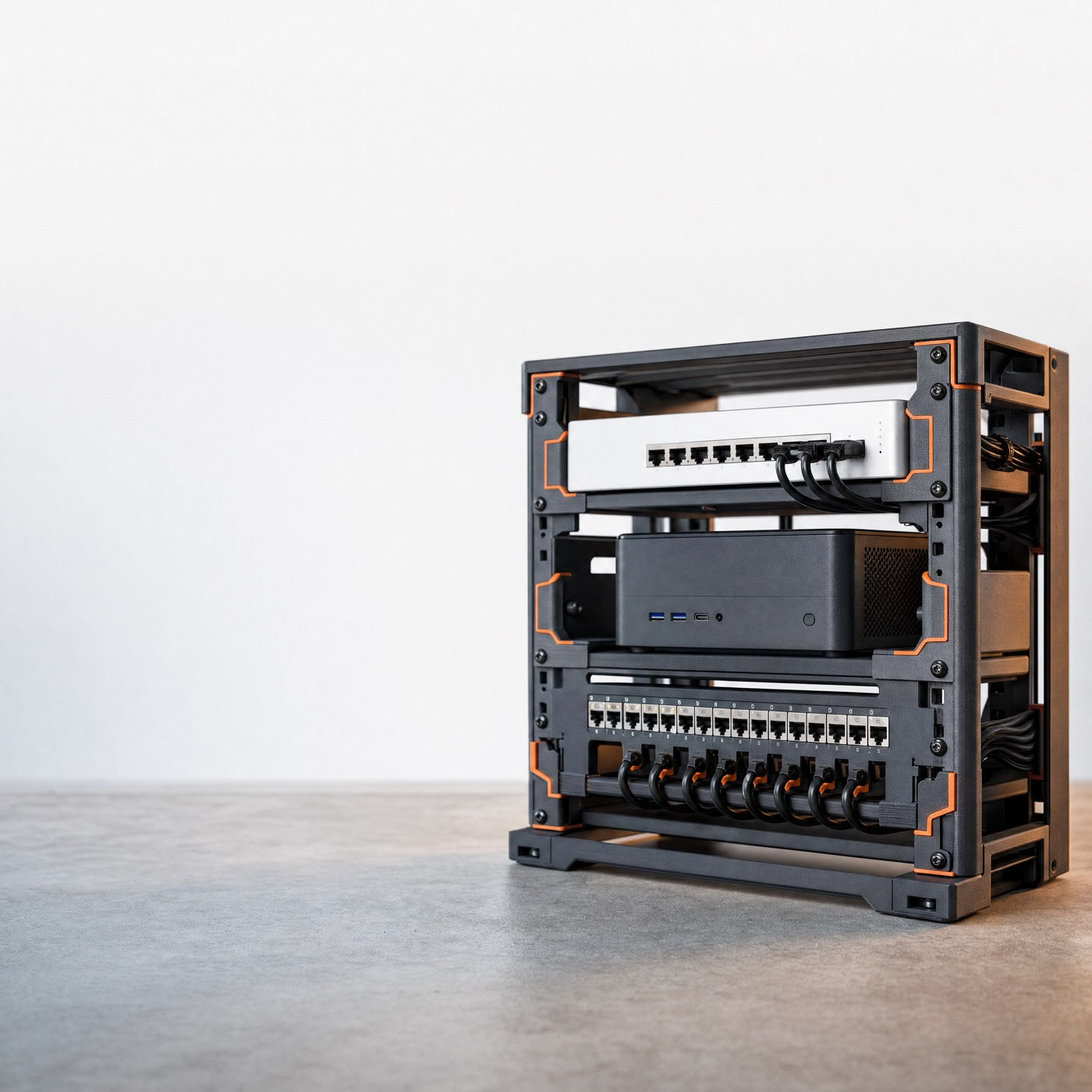 A 10-inch mini rack of network and mini-PC gear in 3D-printed Rack Forged mounts